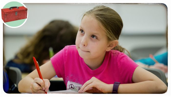 a girl writing in class