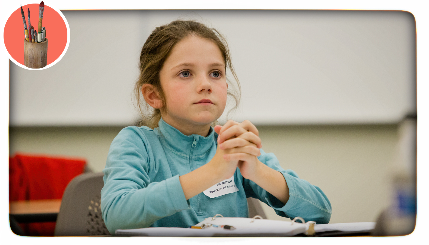 a girl sitting quietly in class